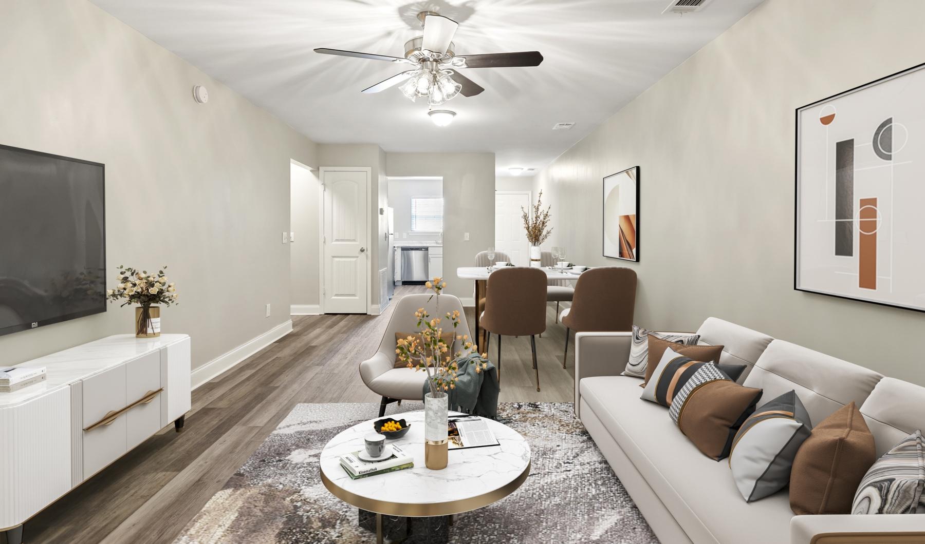 a living room with a large ceiling fan