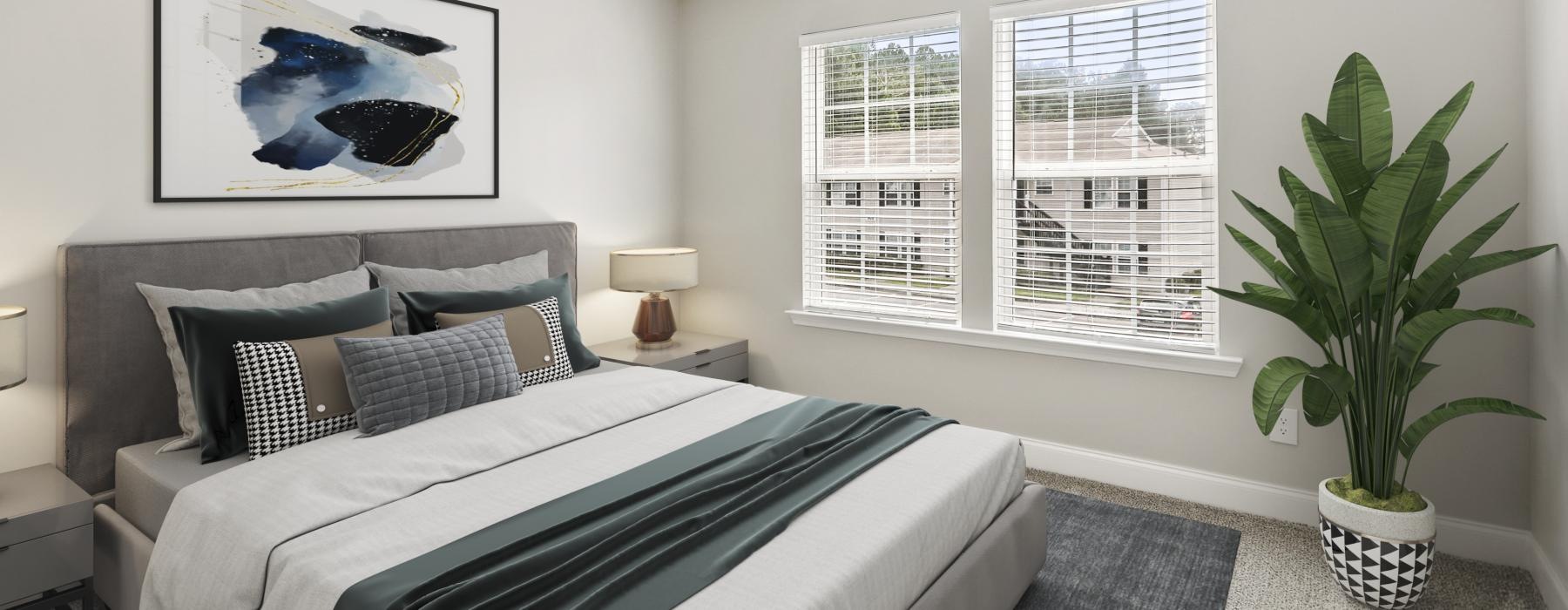 a bedroom with a bed and a fan